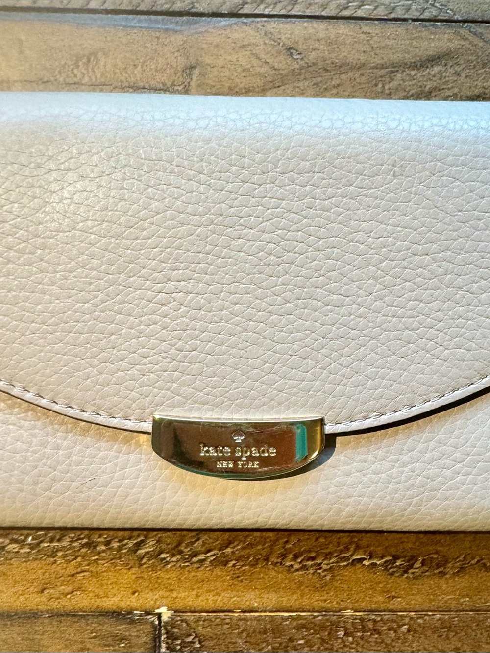 kate spade Cream Pebbled Leather Wristlet with Gold-Tone Plaque